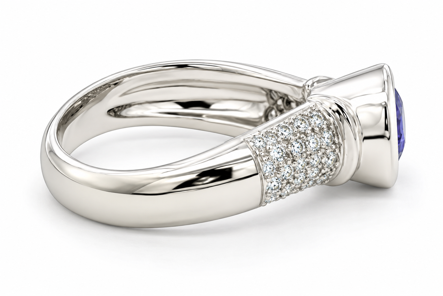 A white gold ring featuring a pavé diamond band and a tanzanite center stone, shown on a clean white background.