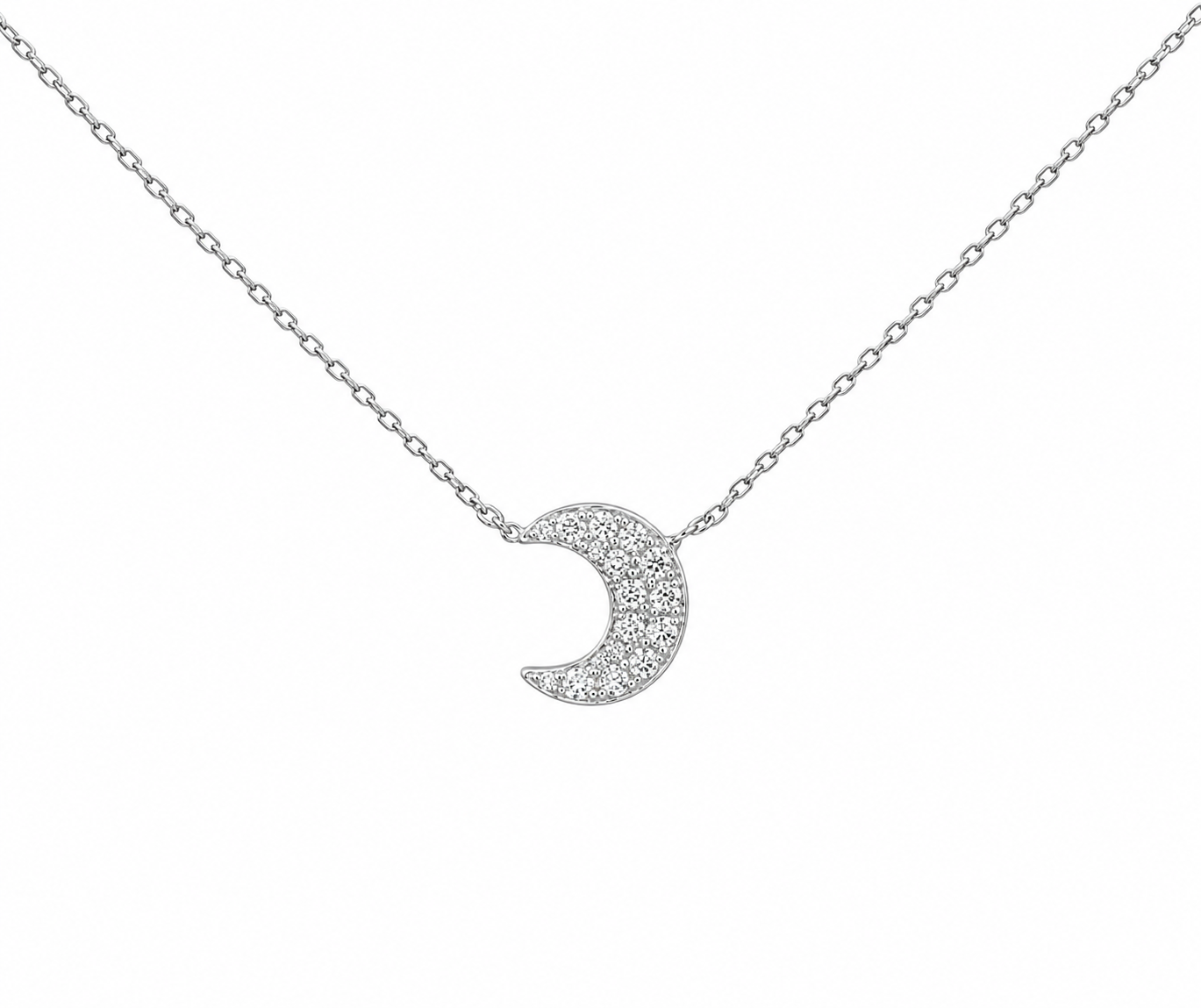 A white gold crescent moon pendant necklace paved with small clear stones, suspended from a delicate link chain against a plain white background.