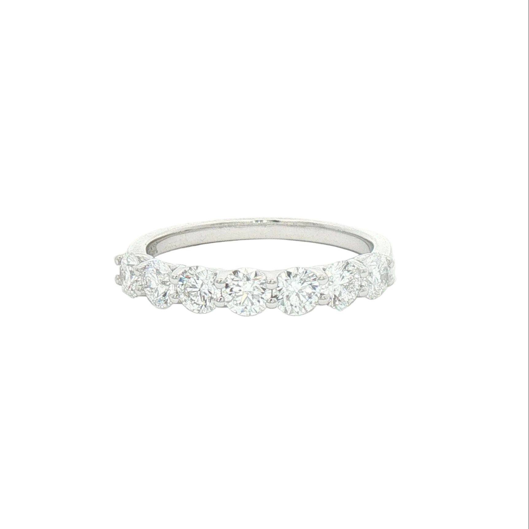 A white gold lab-grown diamond eternity ring with five round-cut diamonds set in a polished white gold band.