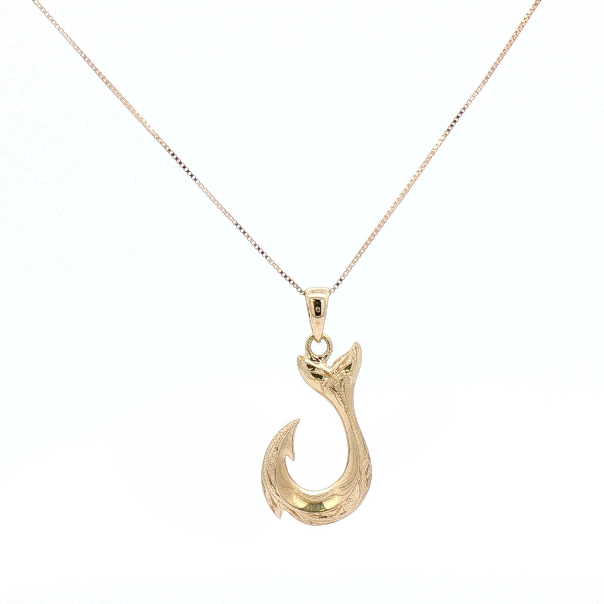 Yellow gold fish hook necklace.
