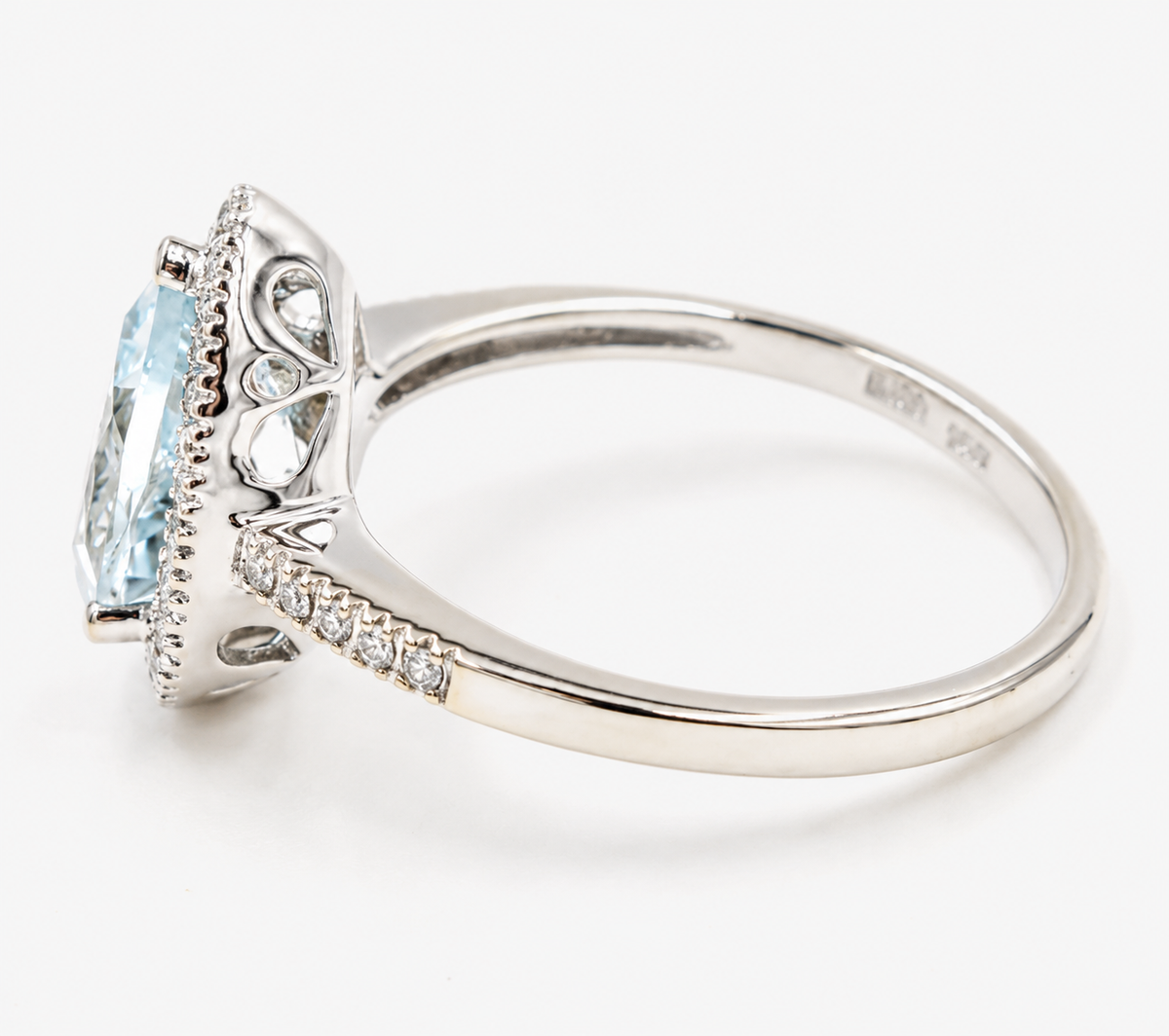 Kent Island Jewelry Estate 14k White Gold Diamond & Pear Cut Aquamarine Gemstone Ring with a diamond halo and pavé band.