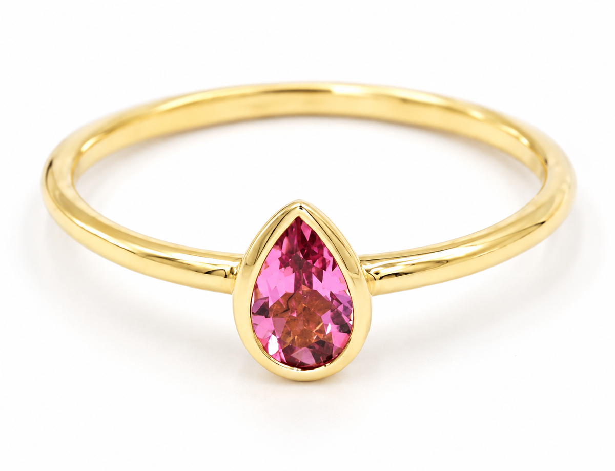 Estate 14k Yellow Gold Pear Cut Pink Tourmaline Gemstone Ring in 14K yellow gold with a bezel-set pear-cut pink tourmaline.