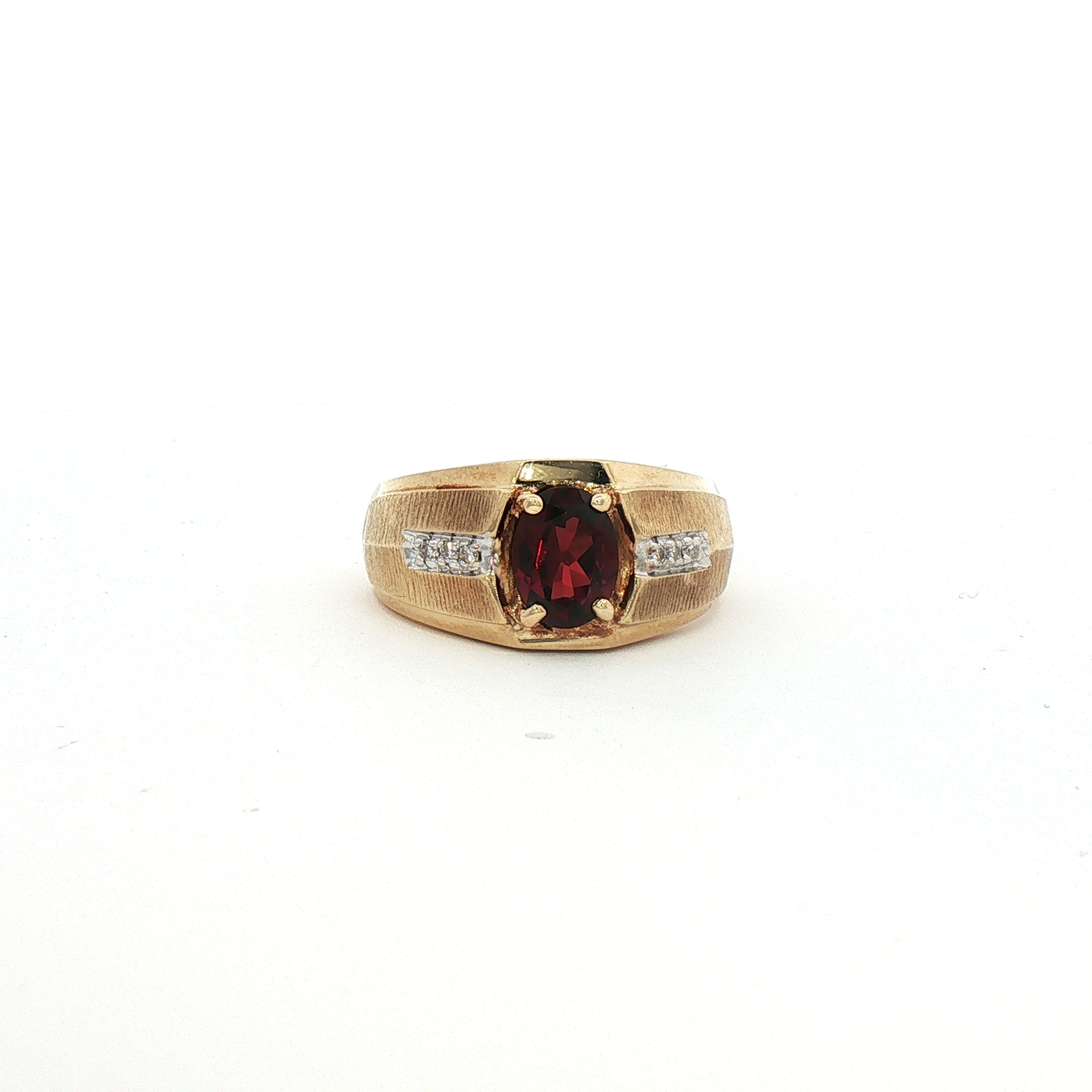 Kent Island Jewelry's Estate 14K yellow gold ring features Mozambique garnet and diamonds, shown on a white background.