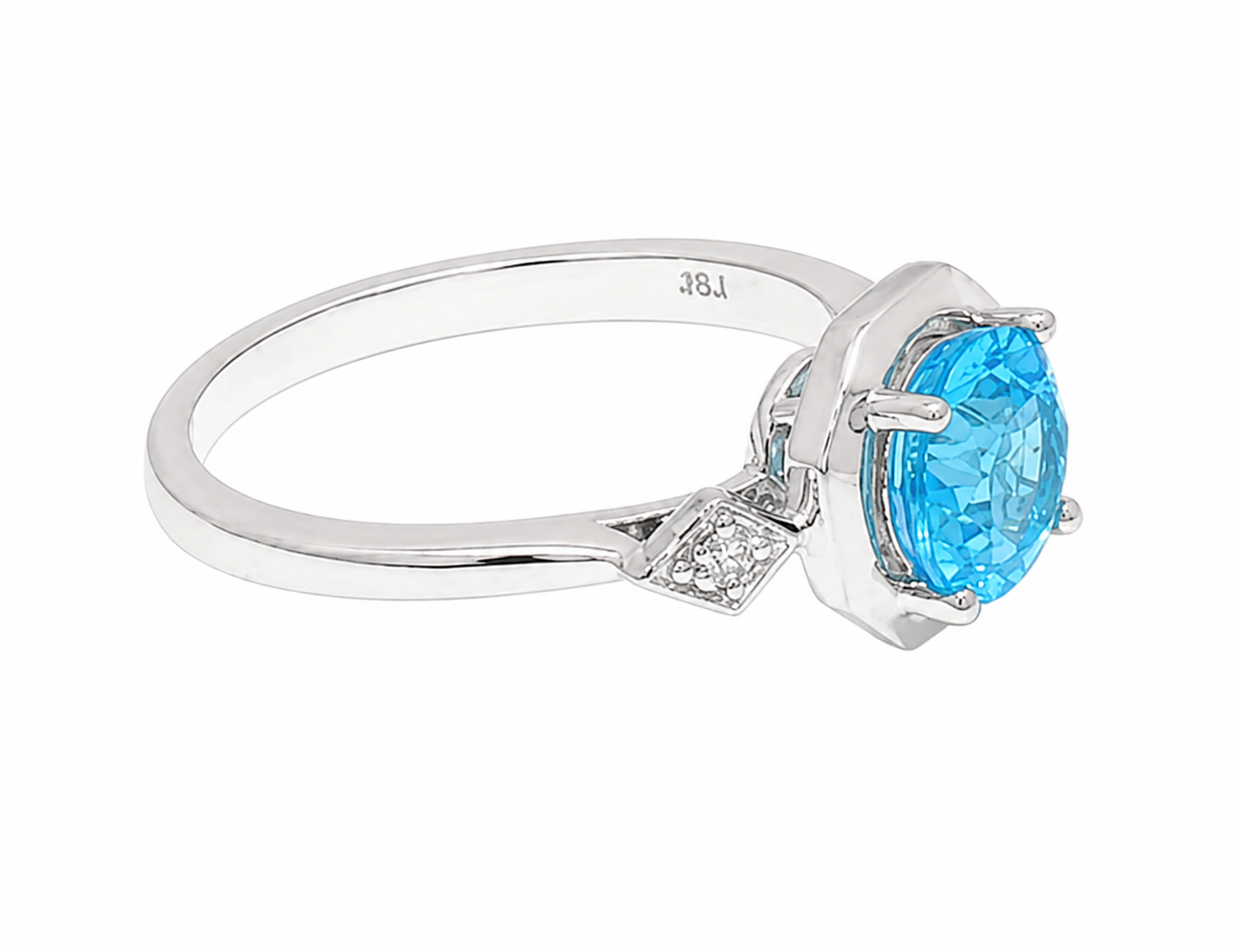A white gold ring featuring a large oval-cut light blue gemstone in a prong setting, with a small diamond accent on the band, shown on a plain white background.