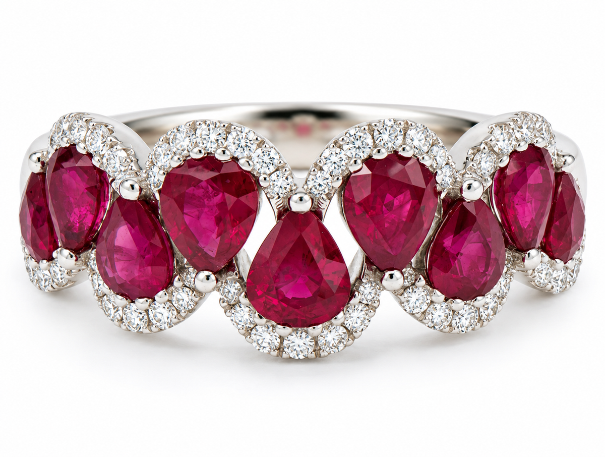 Kent Island Jewelry’s 14K White Gold Ruby & Diamond Band features pear-shape rubies bordered by white diamonds.