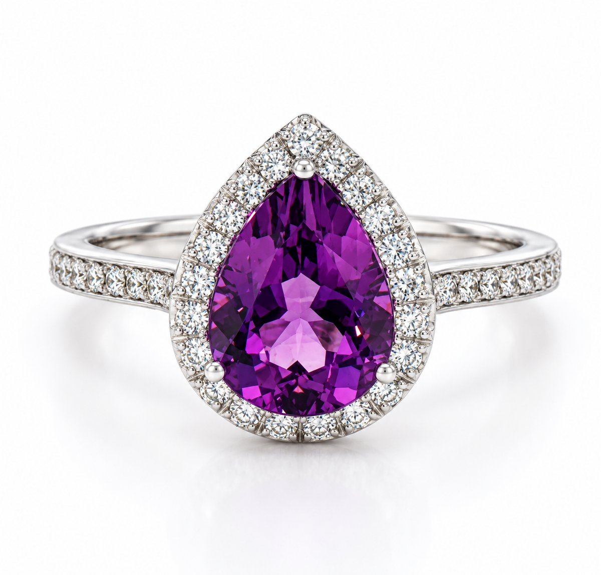 A pear-cut purple amethyst ring in a double halo setting with a diamond-paved band, shown on a clean white background.