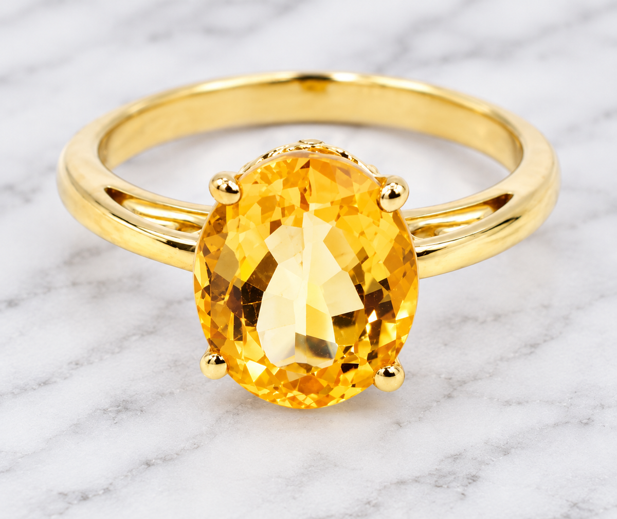 Estate 14k Yellow Gold Citrine Gemstone Solitaire Ring in 14K yellow gold with an oval-cut citrine in a four-prong setting.