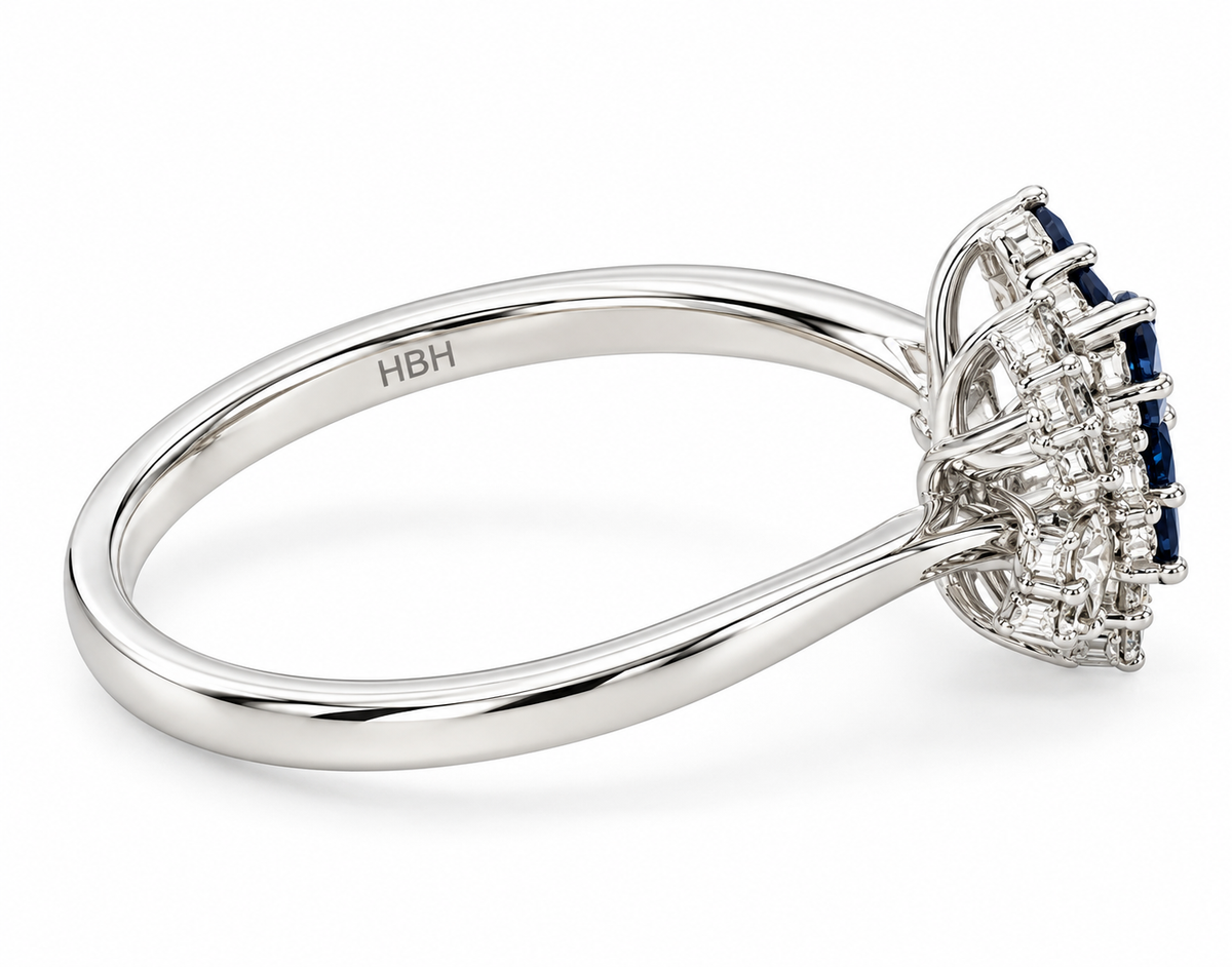 A white gold diamond and blue sapphire cluster ring.