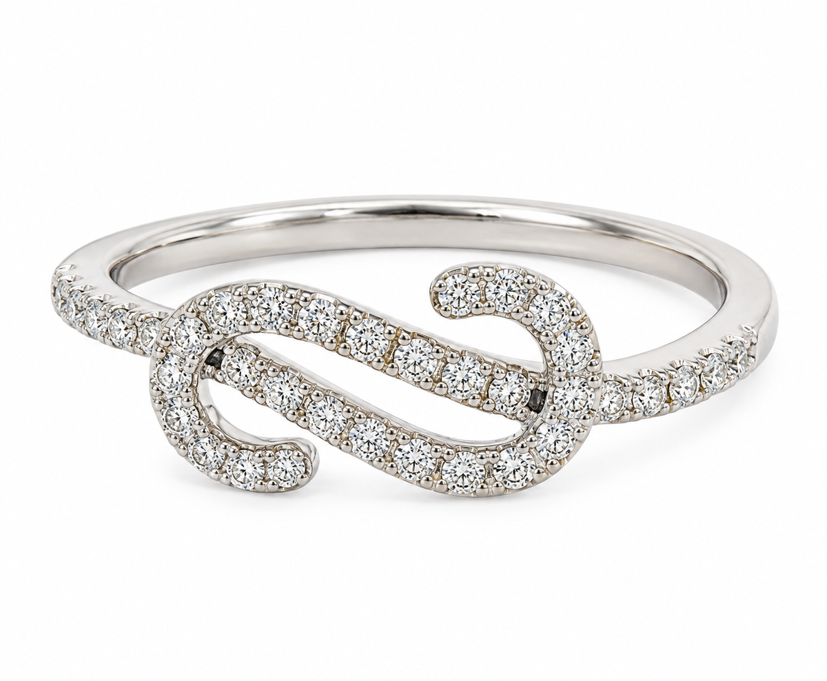 A white gold wrap ring adorned with pavé-set round diamonds, photographed on a clean white background.