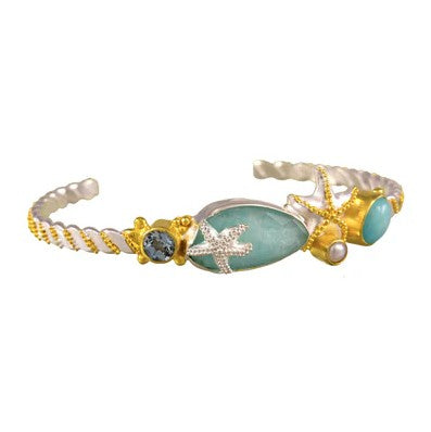 Michou M. Poseidon's Twist Cuff: a gold vermeil bangle with starfish, turquoise stones, and a pearl.