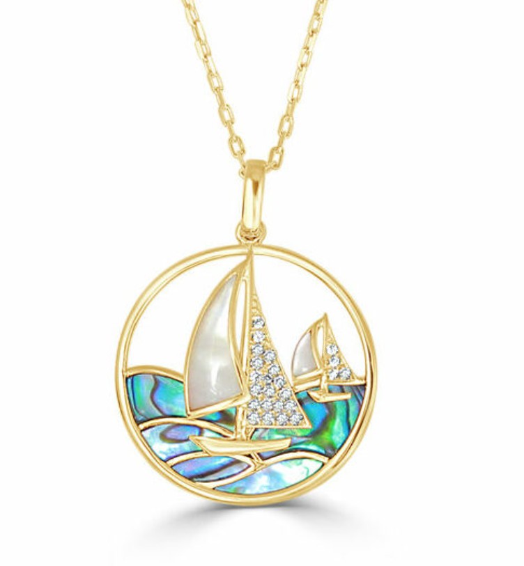 Gold pendant with sailboat design.