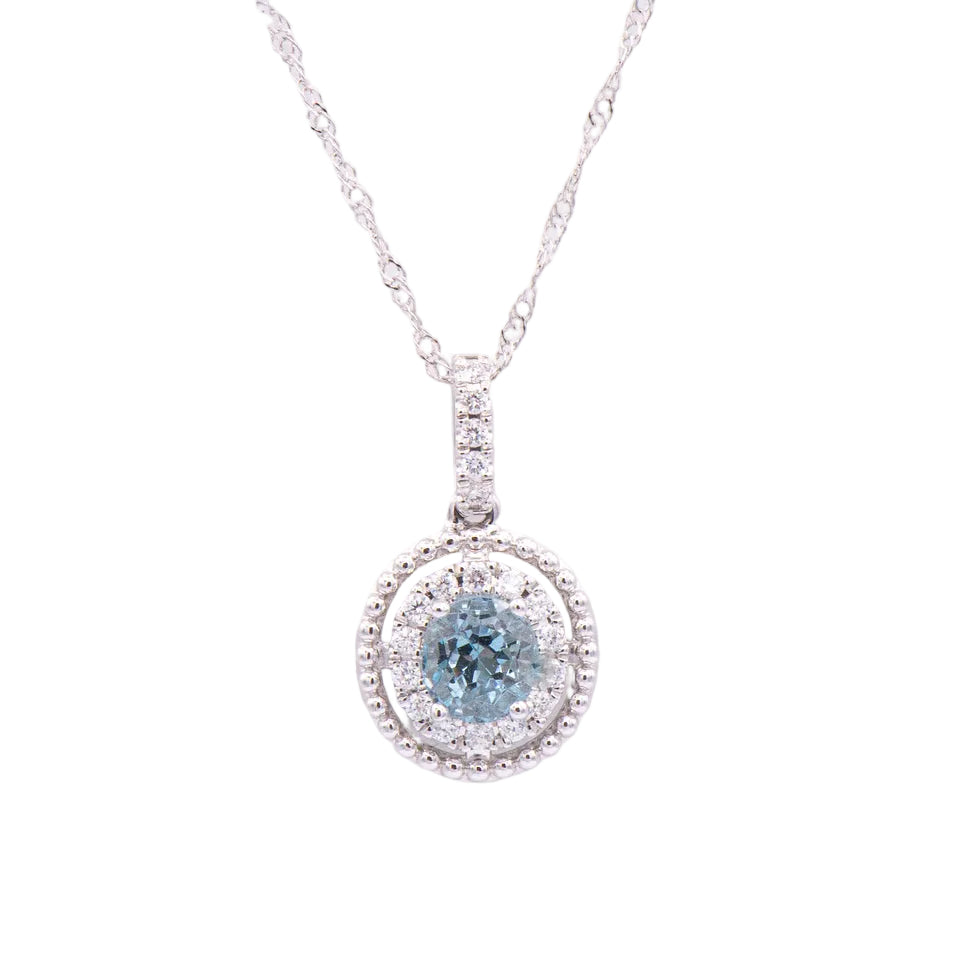 Kent Island Jewelry 14K white gold pendant features a round aquamarine with a diamond halo on a necklace.