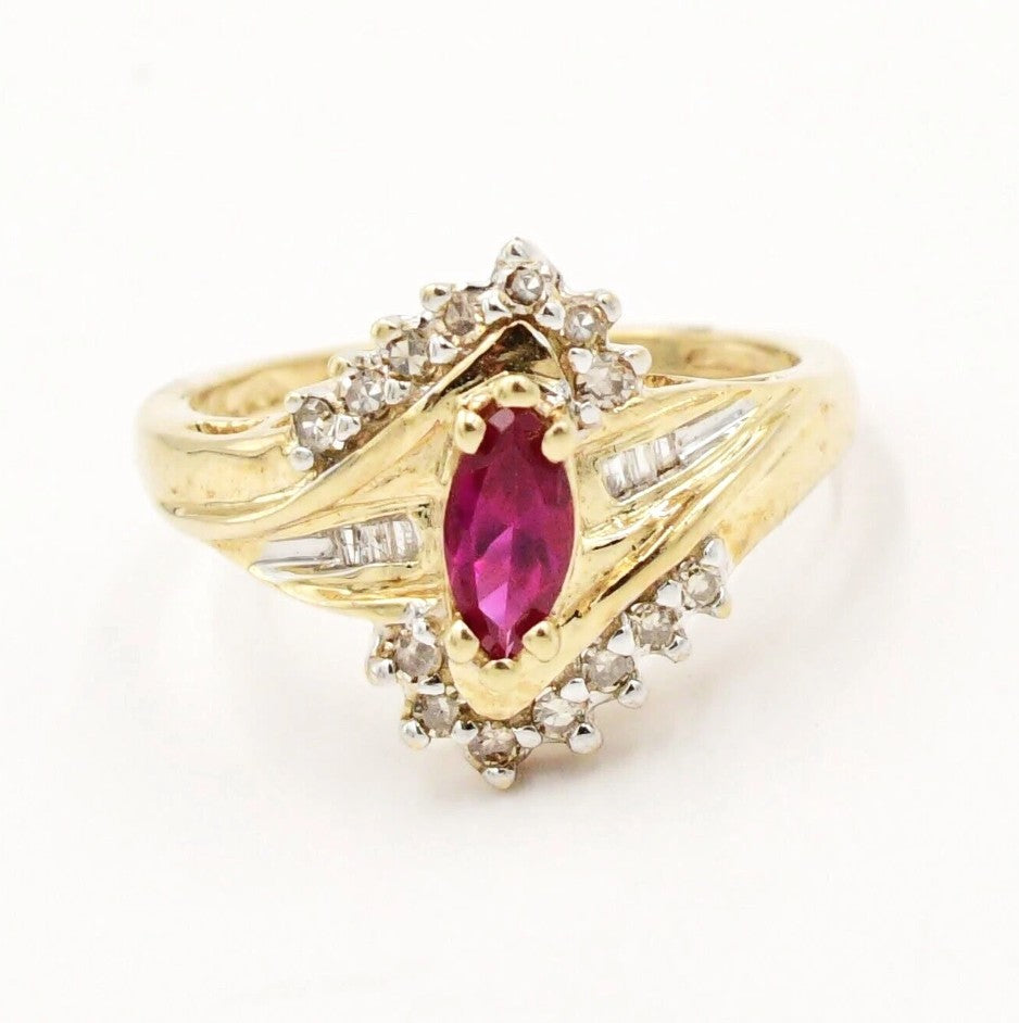 Kent Island Jewelry Estate 10k YG ring with marquise ruby center and .09tcw diamond accents.