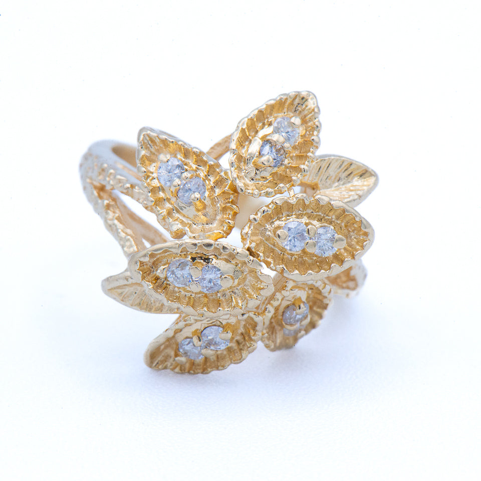 Estate 14K YG Diamond Flower Ring by Kent Island Jewelry, resizable and shown on a white background.