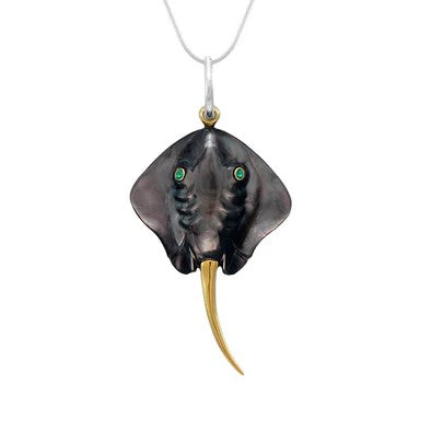 Michou SS Pendant w MOP & Emerald features a stingray shape, green eyes, gold vermeil tail on silver chain.