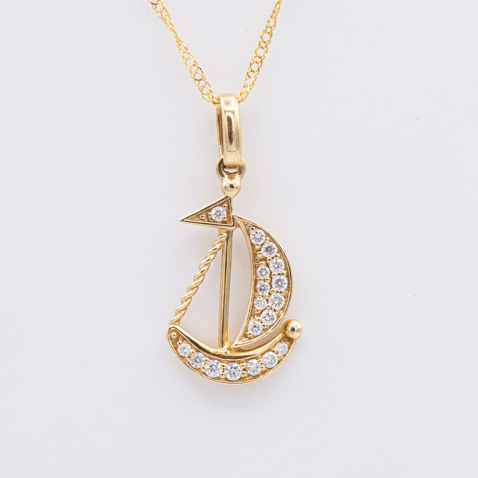 The 14k Diamond Sailboat Necklace by Kent Island Jewelry is perfect for fans of nautical-inspired jewelry.