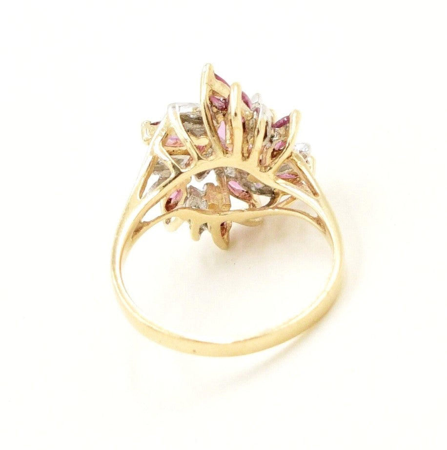 Kent Island Jewelry Estate 10k YG diamond (.04tcw) & ruby cocktail ring, shown from the back on white.