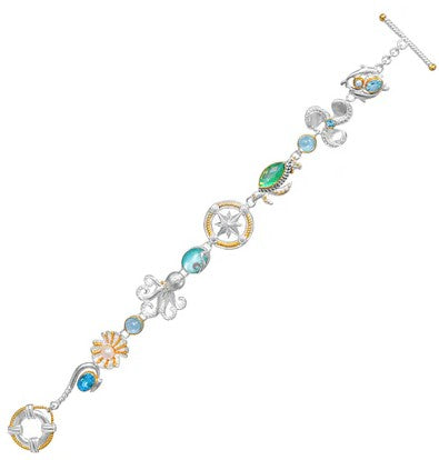 Michou SS & 22K Gold Vermeil bracelet with AZMOPQ, PRL B ocean charms and blue gems.