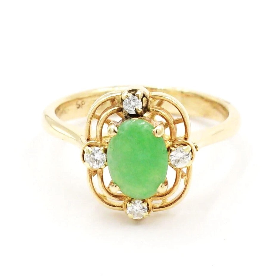 Kent Island Jewelry Estate 14k yellow gold ring with an oval emerald and .04 tcw diamond accents.