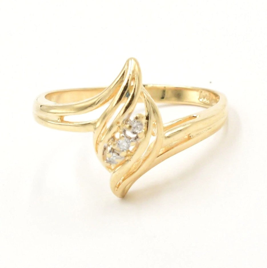 Kent Island Jewelry Estate 10k yellow gold ring with openwork and three diamonds (.03 tcw) at the center.