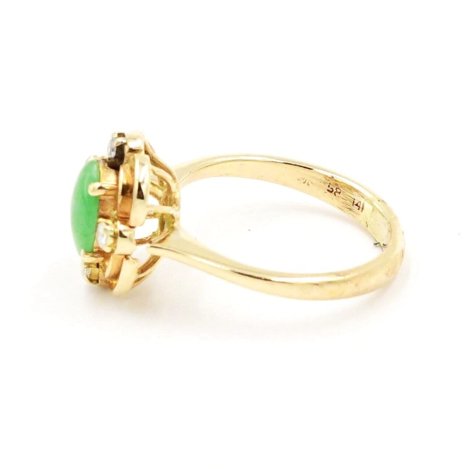 Kent Island Jewelry's Estate 14k yellow gold ring features diamonds (.04 tcw) and emerald, shown from a side view.