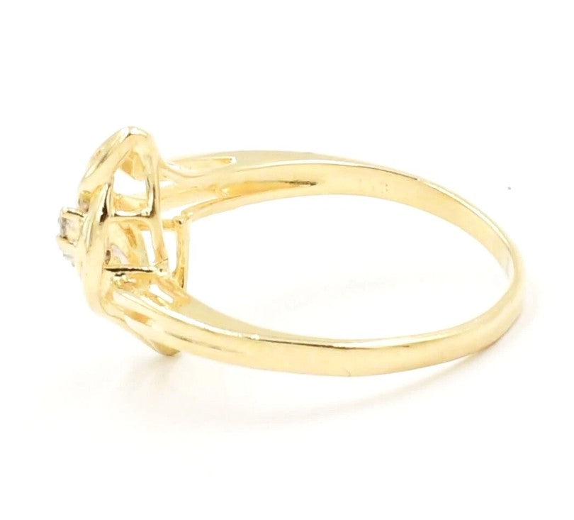 Estate 10k yellow gold three-stone diamond ring by Kent Island Jewelry, side view on white background.
