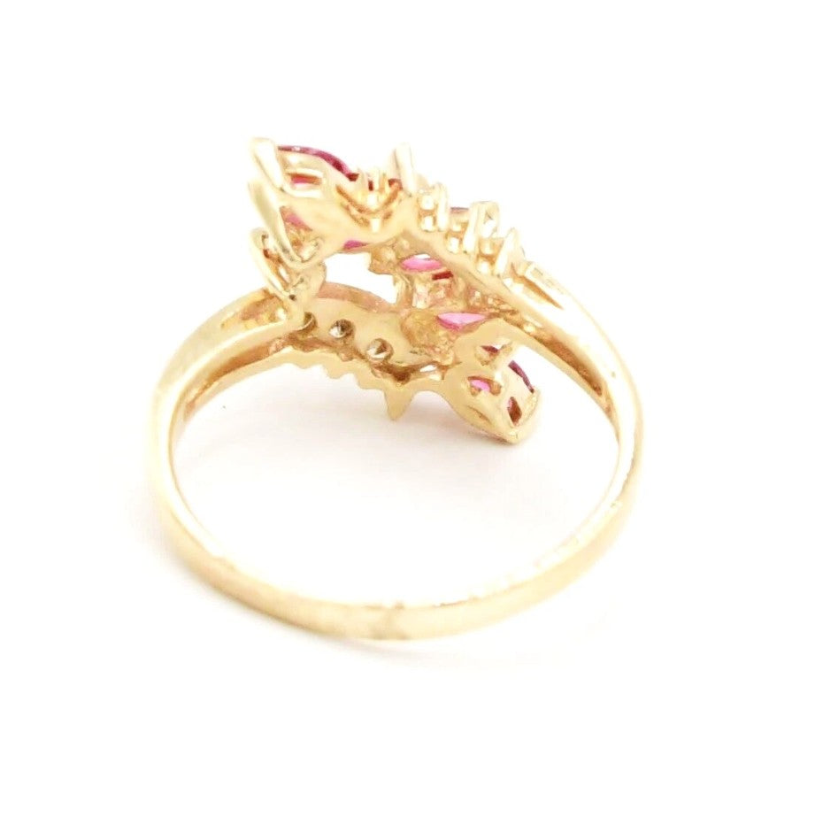 Kent Island Jewelry Estate 14k yellow gold diamond (.08 tcw) & ruby ring with an intricate dragon design.