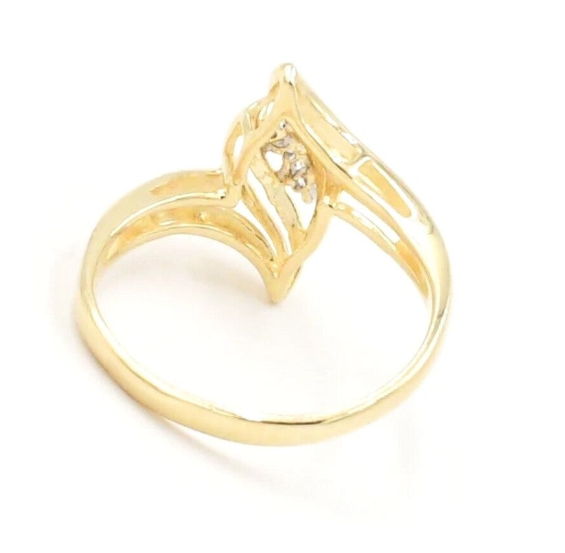 Estate 10k yellow gold three-stone diamond open work ring by Kent Island Jewelry, shown at an angle.