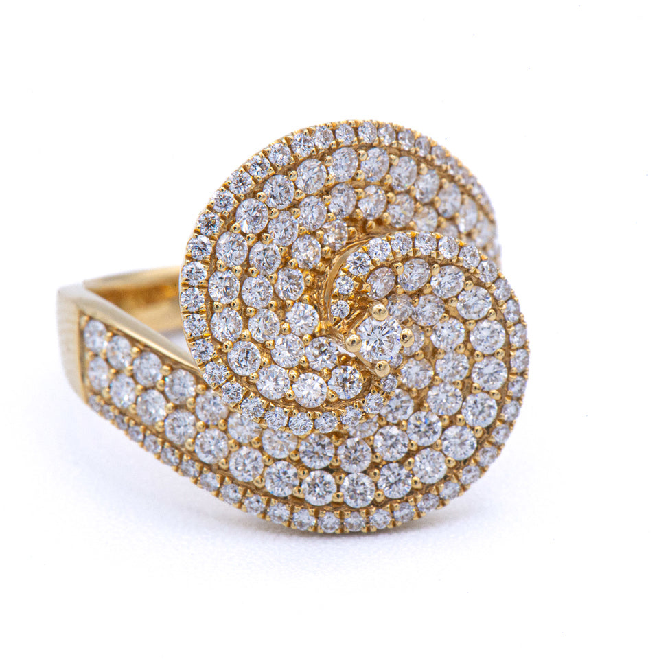 Kent Island Jewelry’s 18k. Diamond Spiral Pave Ring has an elegant, resizeable design—consult your jeweler for sizing.