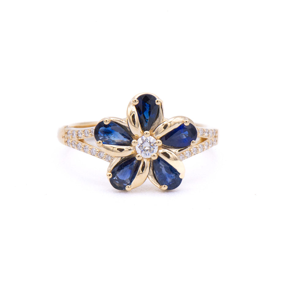 The Alamea 14K Diamond Sapphire Plumeria Ring features blue sapphires and diamonds in a floral-inspired gold design.