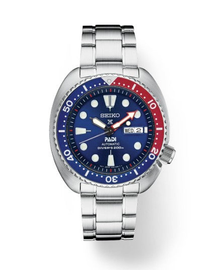 The Seiko Prospex Diver PADI SE is an automatic watch with blue dial, SS bracelet, day/date, and 200m water resistance.