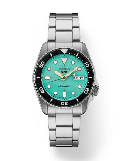 Seiko 5 Sports SS Automatic watch with green dial, black bezel, and day-date window by Seiko.
