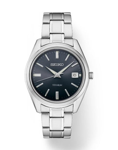 A Seiko Essentials TI Quartz watch with a blue dial and silver markers and hands.