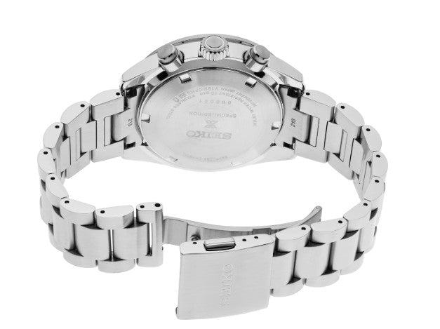 Seiko Prospex Speedtimer SS Solar Chronograph with blue dial, open clasp, and case back visible.