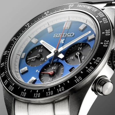 Close-up of a Seiko Prospex Speedtimer SS Solar Chronograph with a blue dial, black subdials, and tachymeter bezel.