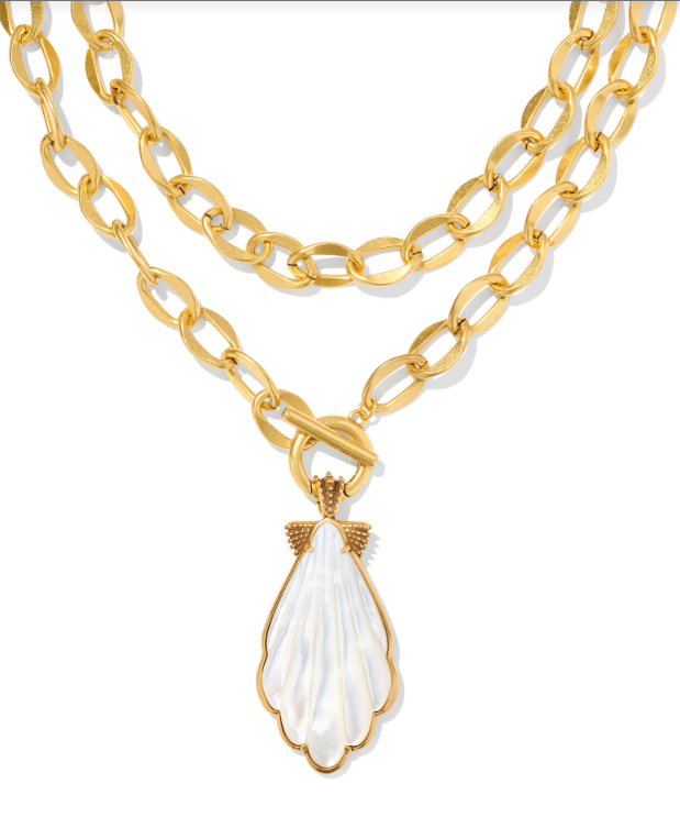 Kendra Scott ALEXA statement necklace with vintage gold chain and ivory mother-of-pearl scallop shell pendant.