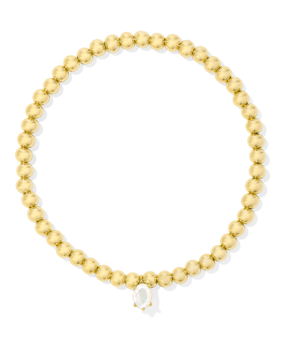 Kendra Scott Cailin stretch bracelet in gold with ivory mother of pearl, shown on a white background.