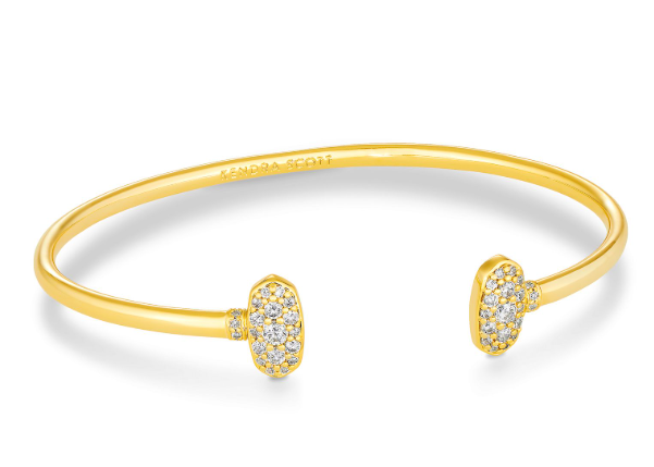 The Kendra Scott Grayson Gold Cuff has hexagonal white CZ ends and an engraved logo, perfect for stacking.