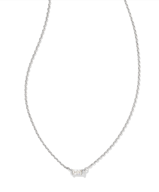 The Kendra Scott Juliette pendant necklace in rhodium features a small white crystal baguette at the center.