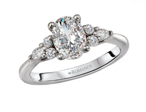The Romance Diamond Semi-Mount Engagement Ring by Romance features oval and marquise diamonds with an engraved band.