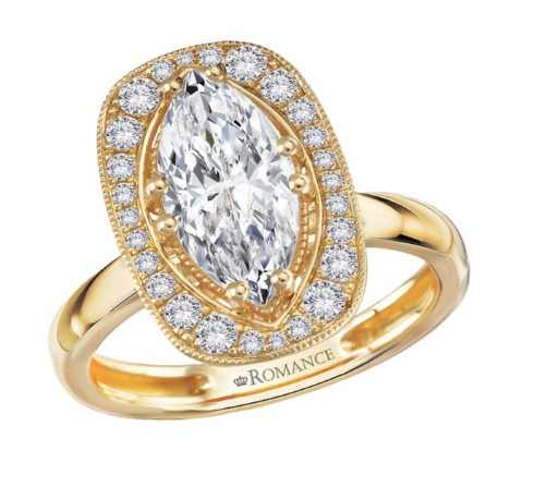 The Romance Engagement Ring features a marquise center with a cushion halo, crafted in 14kt yellow gold.