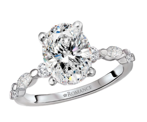 The Romance Semi-Mount Diamond Engagement Ring features side stones and "ROMANCE" engraved on the white gold band.