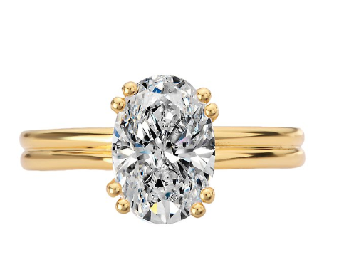 The Romance Double Ring Band and Double Prong Diamond Engagement Ring in 14kt yellow gold, shown on a white background.