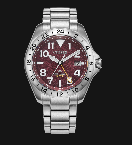 Citizens Promaster Land GMT: silver metal band, red face, bold white numerals, and date window.