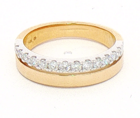 A yellow gold ring with a row of small clear gemstones across the top, photographed on a plain white background.