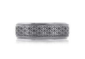 Silver colored tantalum ring with geometric pattern.