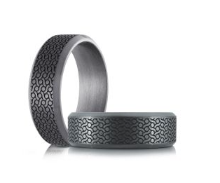 Grey tantalum laser engraved ring.