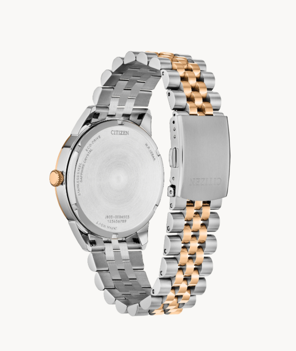 Back of the Rolan Citizen's Watch by Citizens, silver-gold band, clasp, and engraved accents.