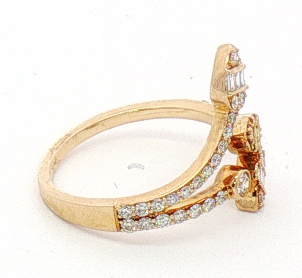 Roman & Jules 14K yellow gold bypass ring with round and baguette diamonds set along band, side view.