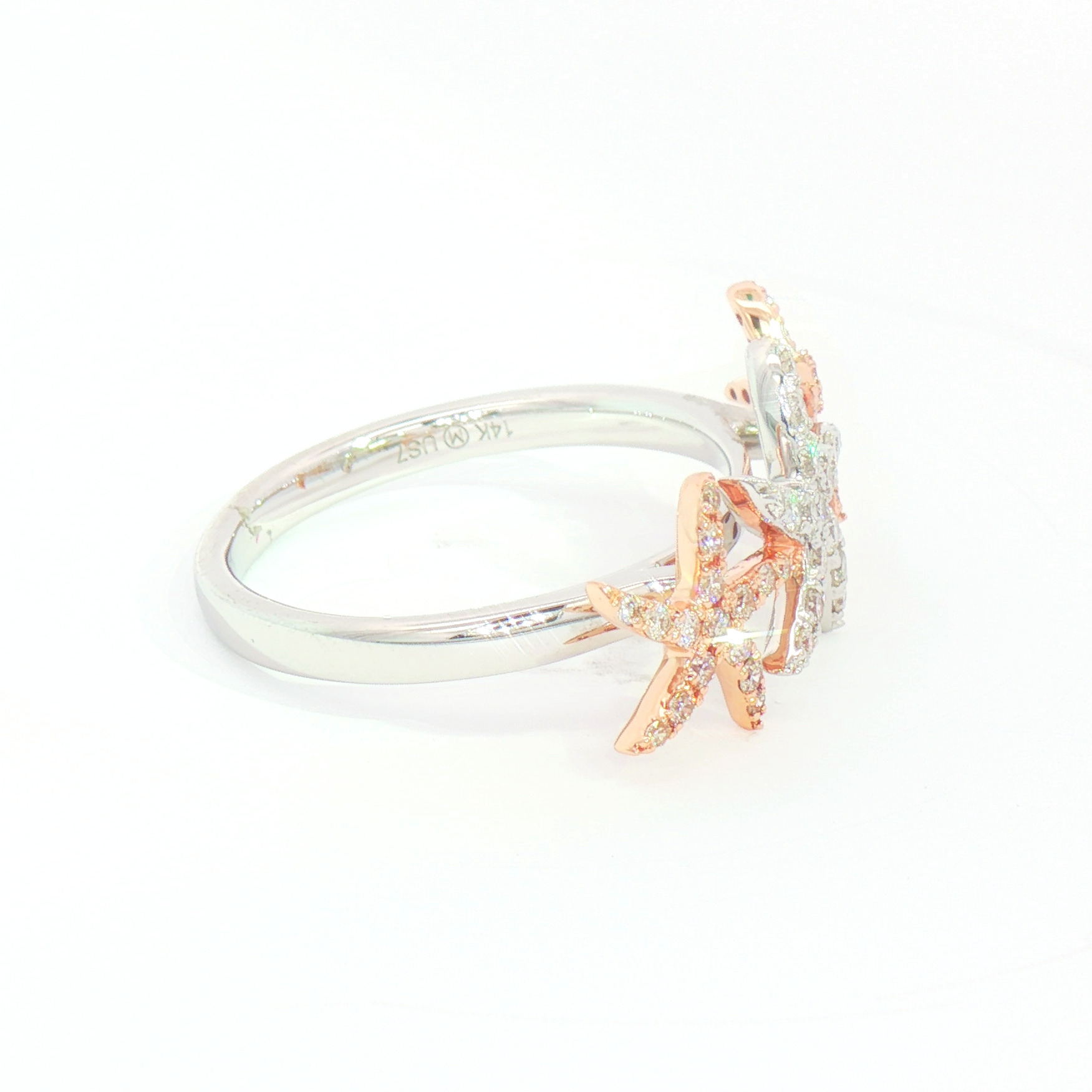 Kent Island Jewelry's 14K 2T Diam Starfish Ring (0.33ctw) features rose gold starfish and clear gems on a white background.